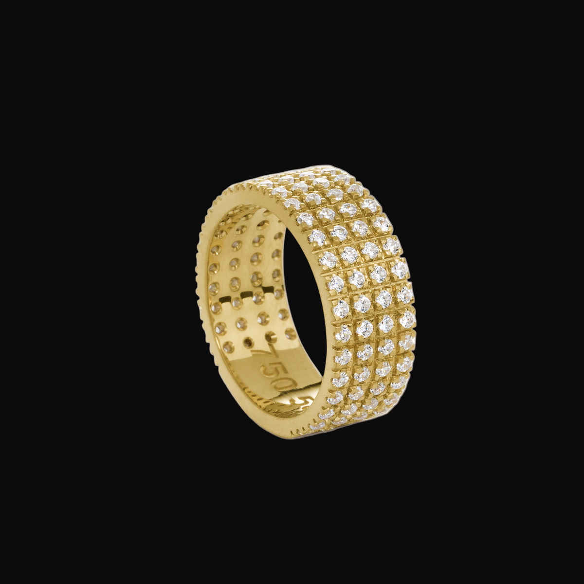 Gold ring with diamond accents on a white background